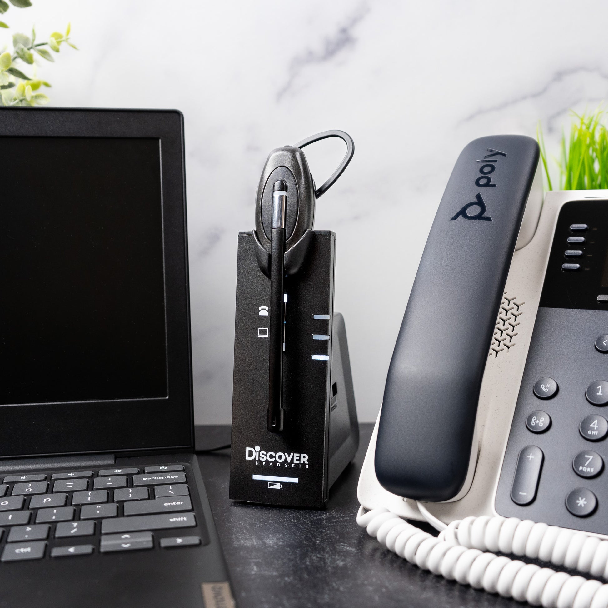 discover d904 dect headset next to laptop and desk phone